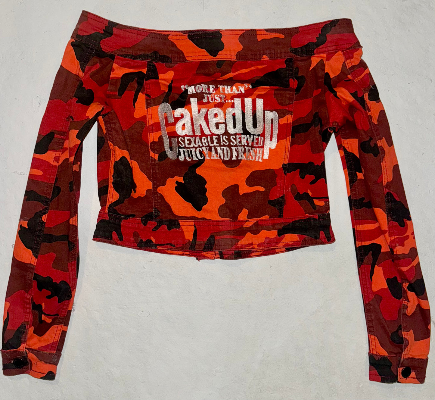 More than just caked up camouflage off the shoulder jacket S