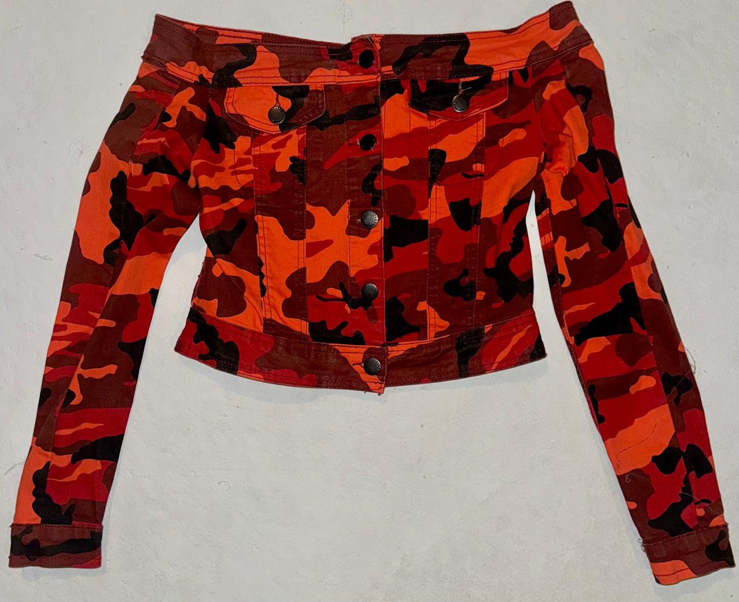 More than just caked up camouflage off the shoulder jacket S